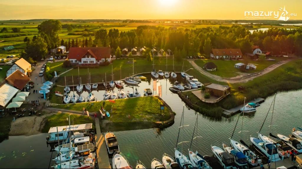 an aerial view of a marina with boats in the water at Marina Górkło - Żurawi Kąt in Górkło