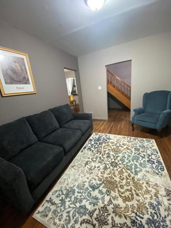 a living room with a couch and a rug at The Hideaway in Cleveland