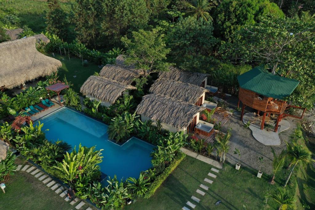 an aerial view of a resort with a swimming pool at MAKAI BEACH HOSTEL in Punta de Piedra