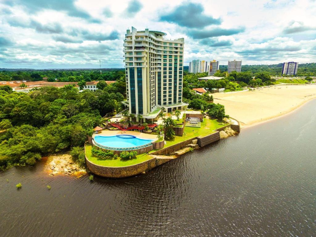 an aerial view of a hotel and the beach at Tropical Executive Hotel 804 - Propriedade Particular in Manaus