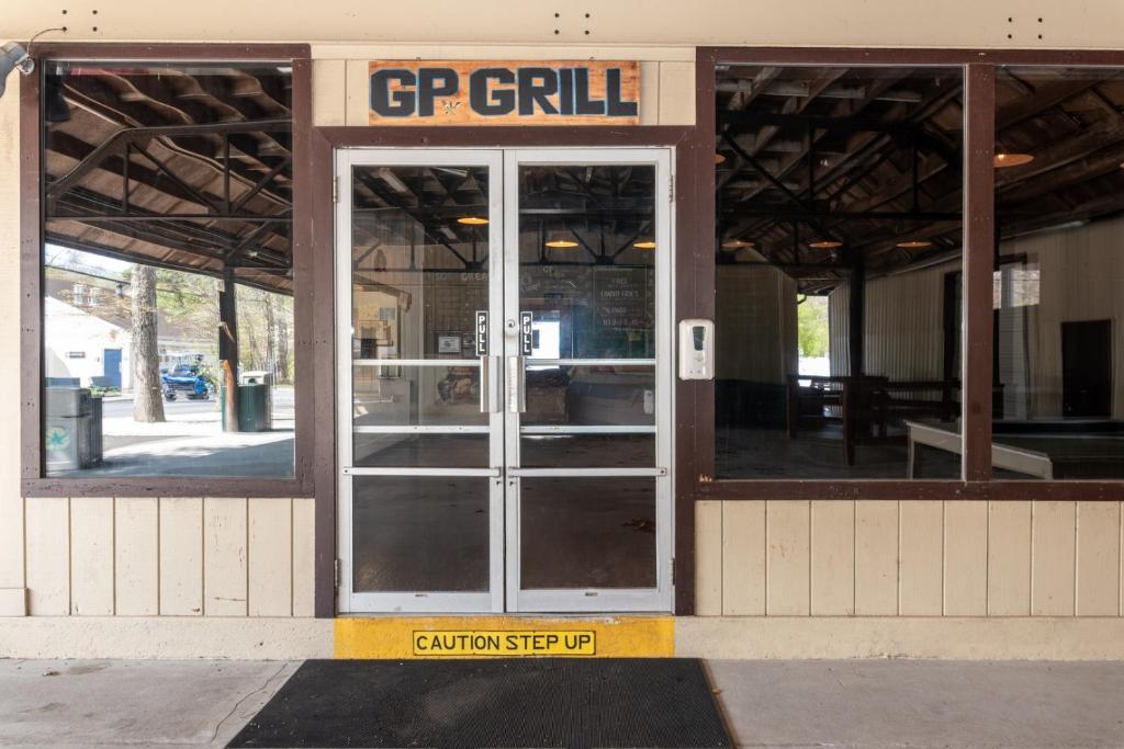an open door of a building with a sign on it at Near Beach • Pool + Amenities • Sleeps 8 in Swain