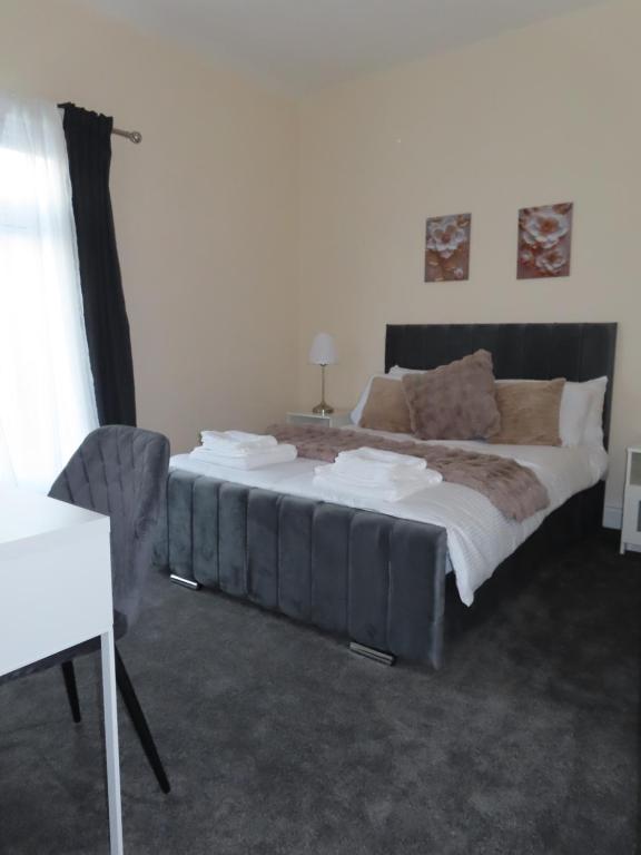 a bedroom with a large bed in a room at Portman House in Middlesbrough