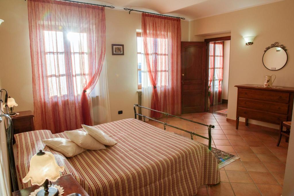 Postel nebo postele na pokoji v ubytování Cascina La Corte