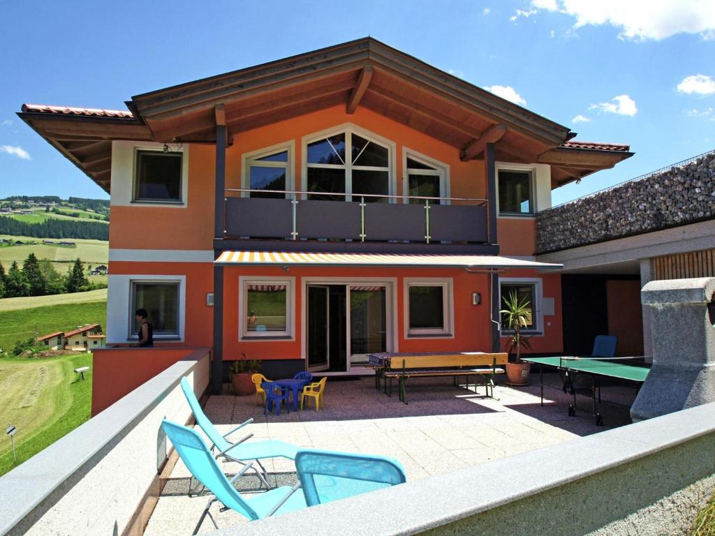 a house with a patio with a ping pong table at Sonnenwinkel I in Kolsassberg