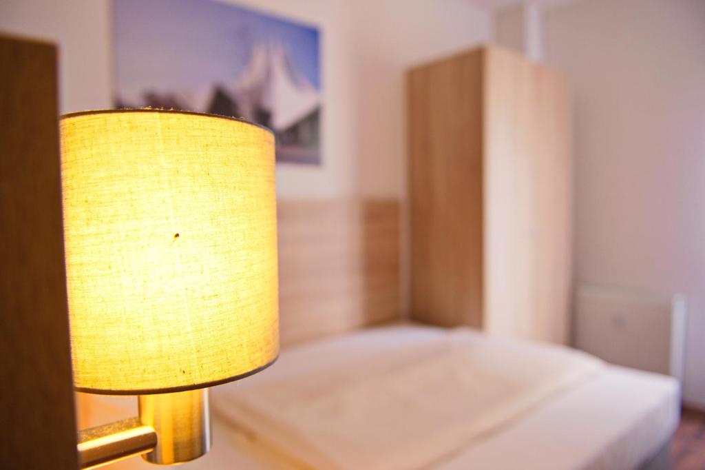 Postel nebo postele na pokoji v ubytování BlnCty Hotel
