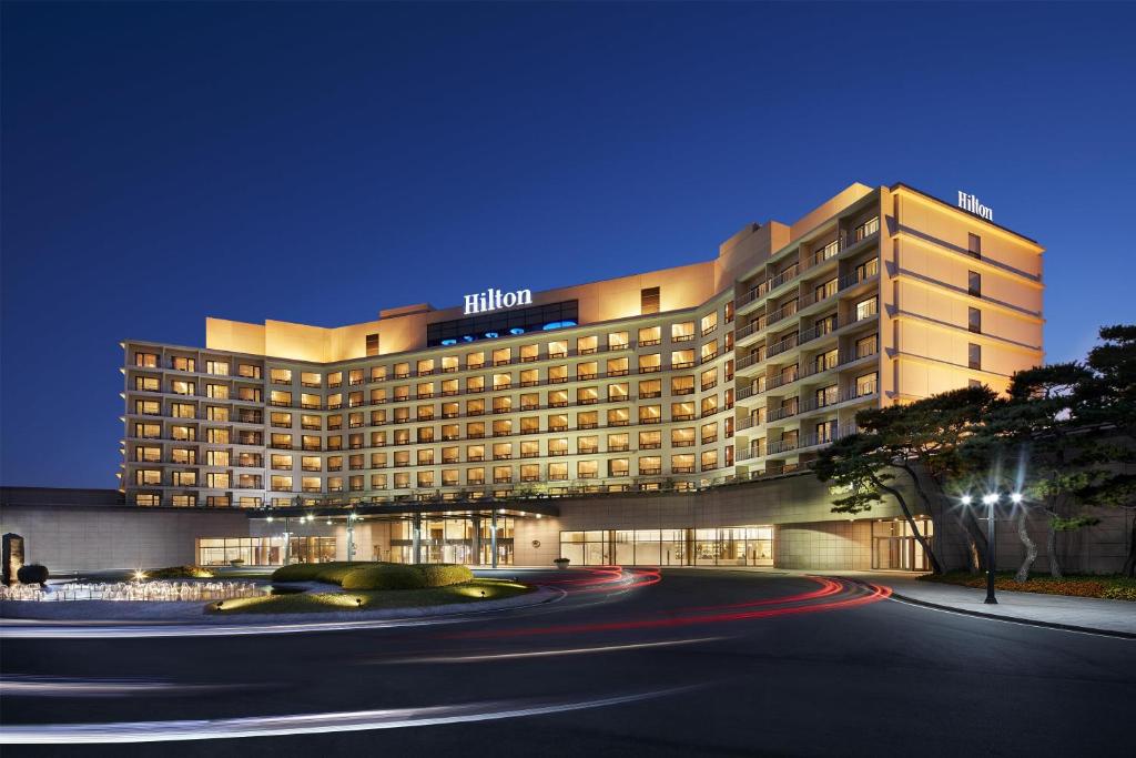a hotel building with a road in front of it at Hilton Gyeongju in Gyeongju