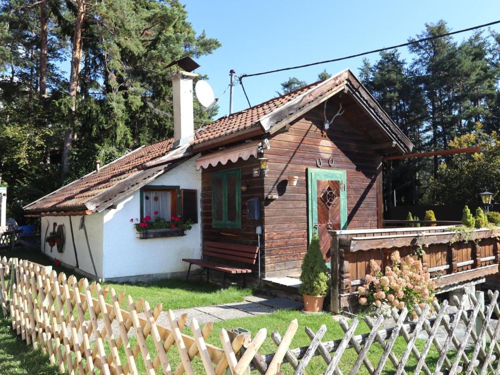a small house with a fence in front of it at Chalet Westermeyr in Mieming