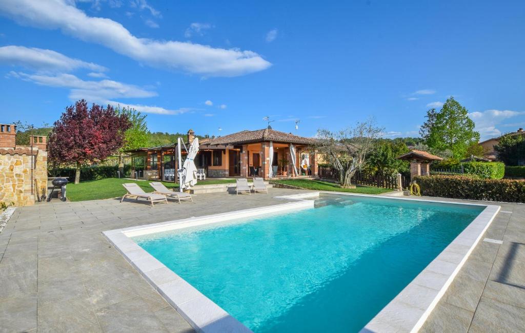 a swimming pool in the backyard of a house at Gorgeous Home In Todi in Todi