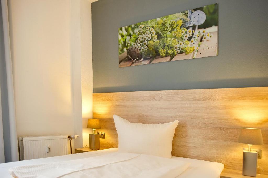 Postel nebo postele na pokoji v ubytování BlnCty Hotel
