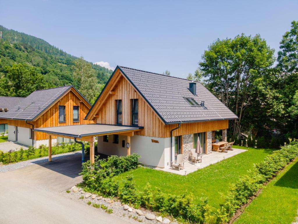 an exterior view of a house with a roof at Mountain Chalet Arnica in Sankt Lorenzen ob Murau