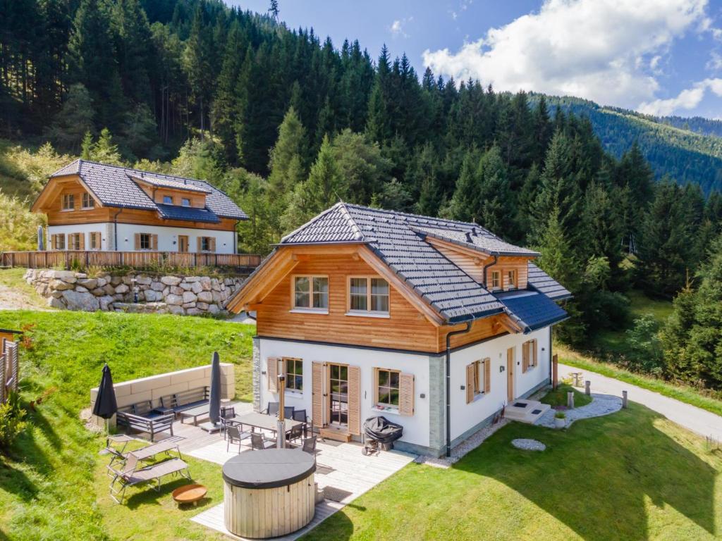 an aerial view of a log home with a yard at Haus Liene in Donnersbachwald
