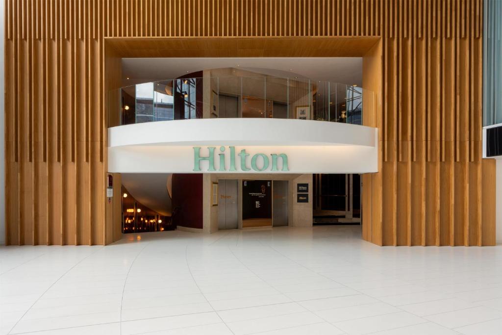 an entrance to a building with a hilton sign on it at Hilton Paris La Défense in Puteaux