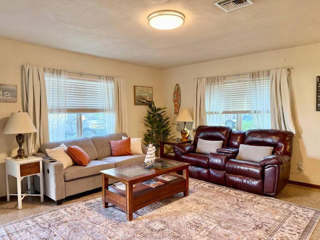 a living room with a couch and a table at Downtown Duplex A Amazing Location in Sanford