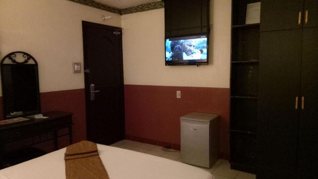 TV a/nebo společenská místnost v ubytování DM Residente Hotel Inns & Villas