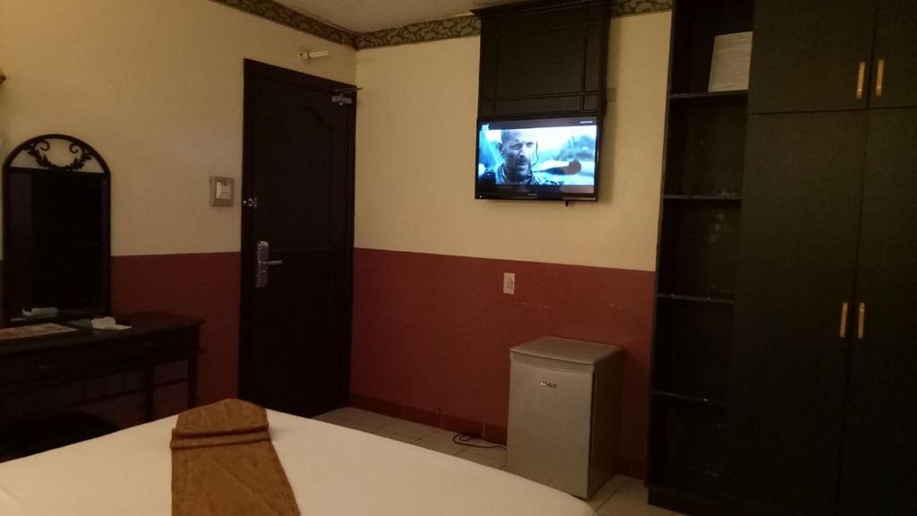 TV a/nebo společenská místnost v ubytování DM Residente Hotel Inns & Villas