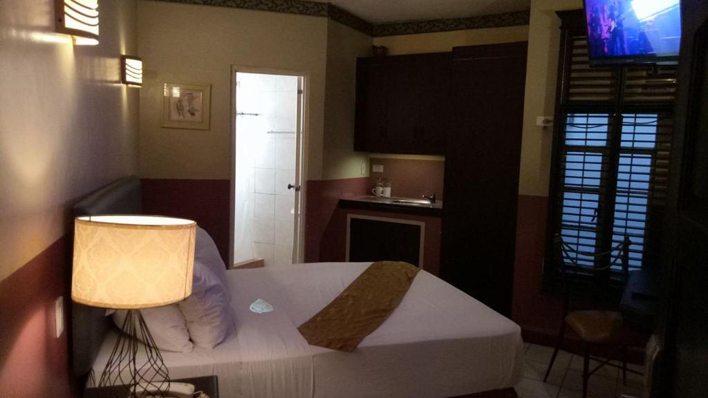 Kuchyň nebo kuchyňský kout v ubytování DM Residente Hotel Inns & Villas