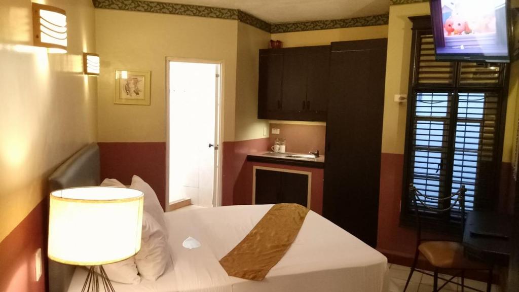 Kuchyň nebo kuchyňský kout v ubytování DM Residente Hotel Inns & Villas
