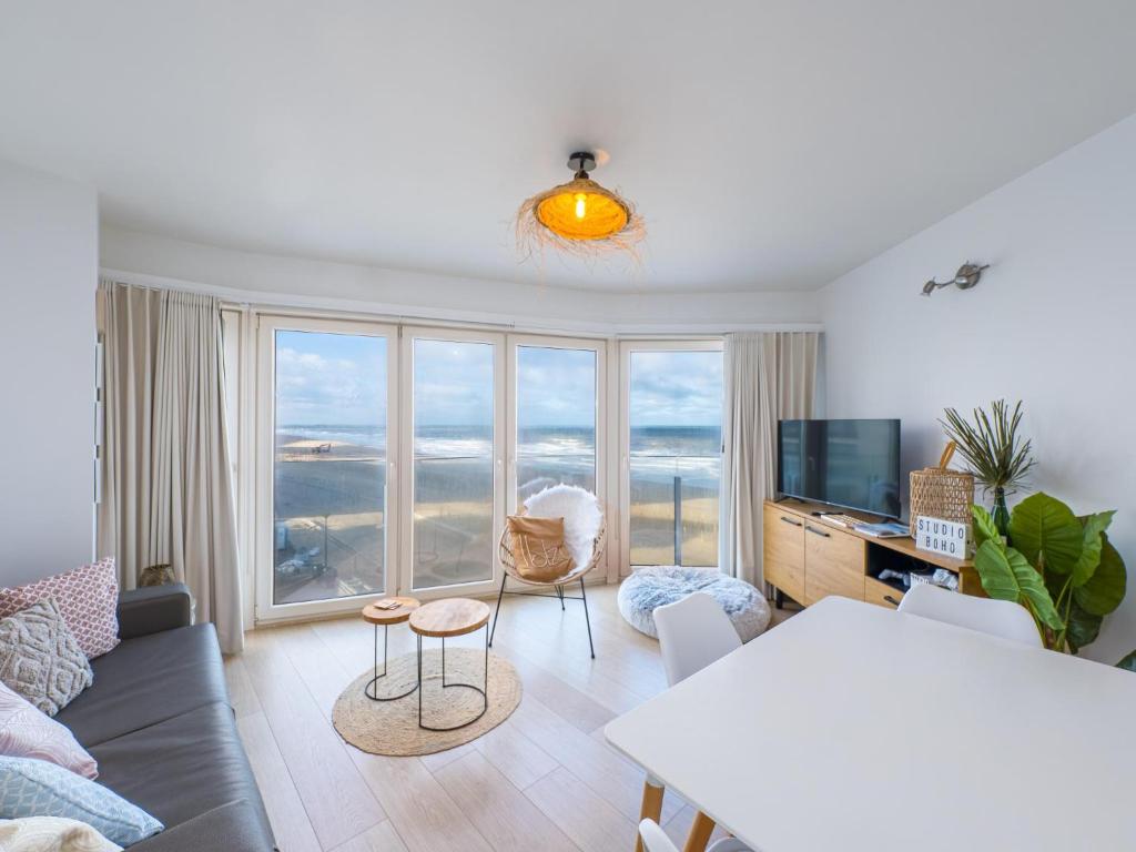 a living room with a view of the ocean at Nautilus - 0301 in Westende-Bad