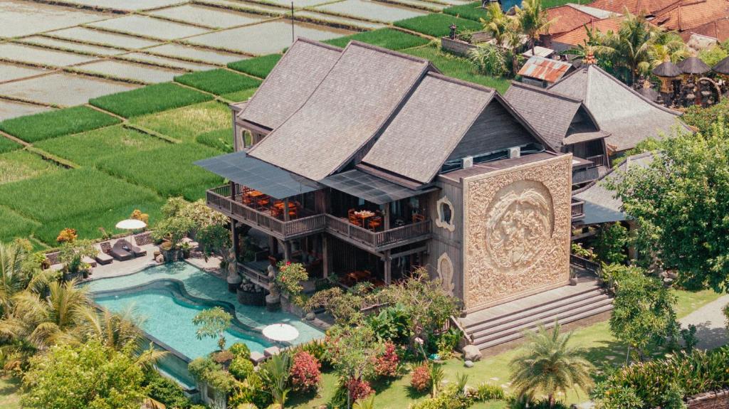 an aerial view of a house with a swimming pool at Royal Roco Villa in Tanah Lot