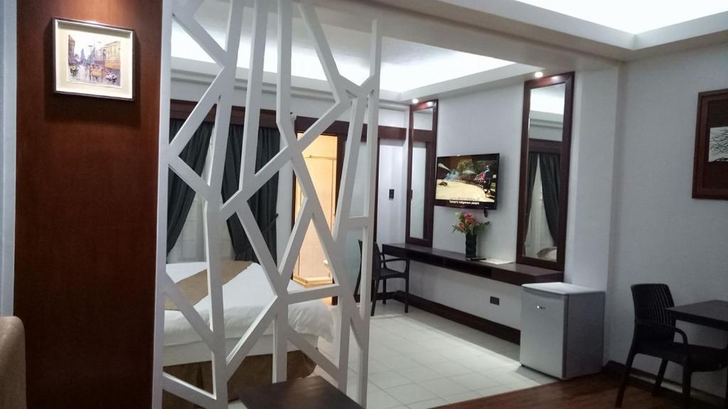 Posezení v ubytování DM Residente Hotel Inns & Villas
