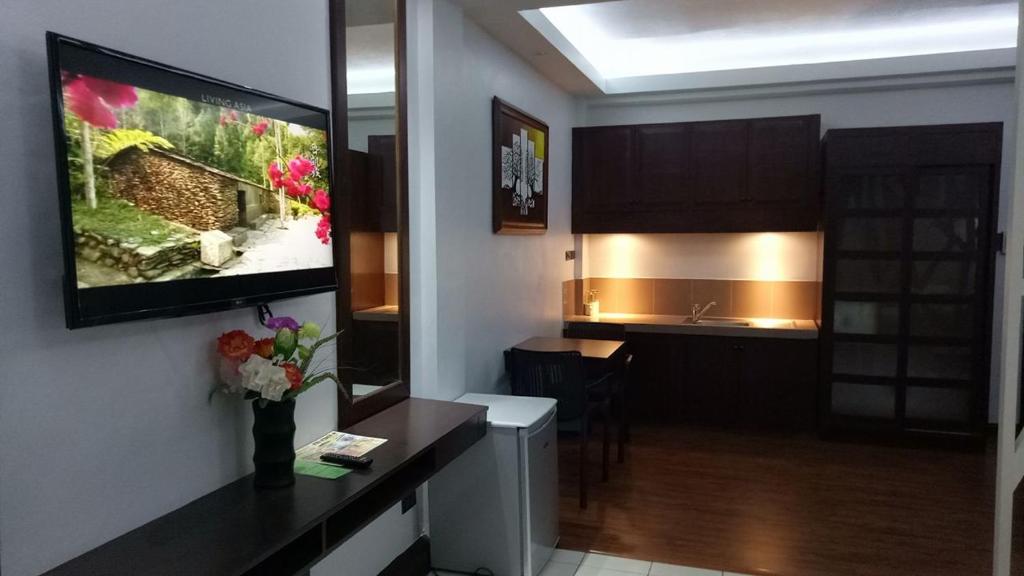 TV a/nebo společenská místnost v ubytování DM Residente Hotel Inns & Villas