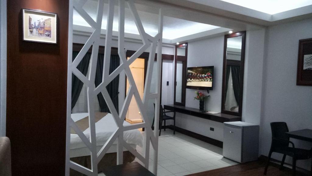 Posezení v ubytování DM Residente Hotel Inns & Villas