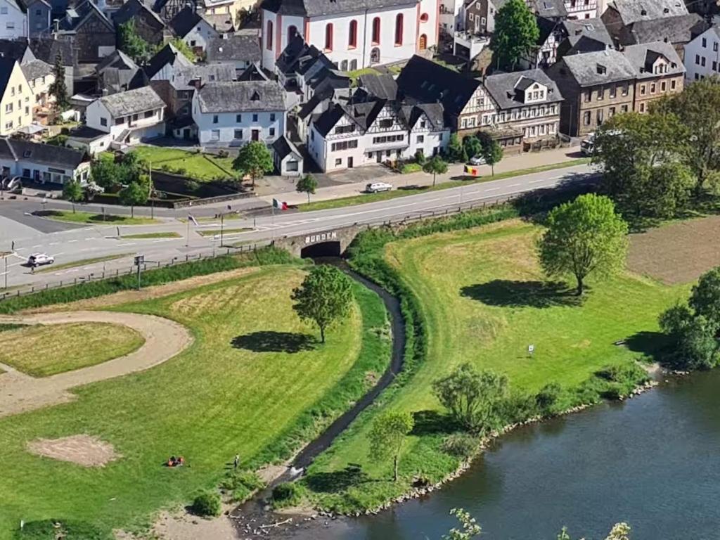 an aerial view of a town with a bridge over a river at Burgen in Burgen
