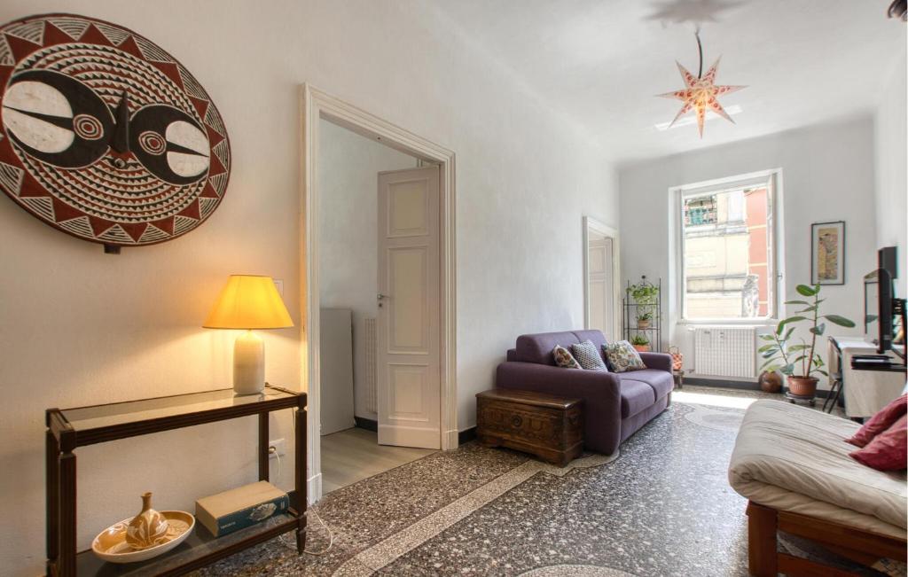 a living room with a purple couch and a table at Casa Garibotti in Recco