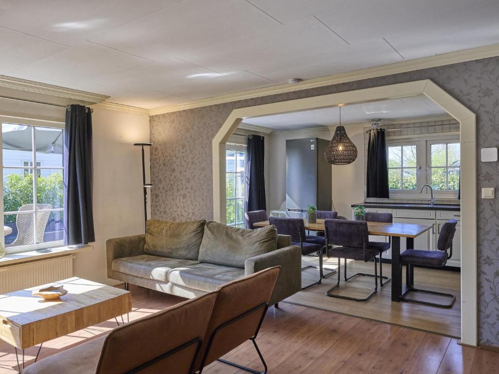 a living room with a couch and a table at t Kaatsheuveltje 2 in Kaatsheuvel