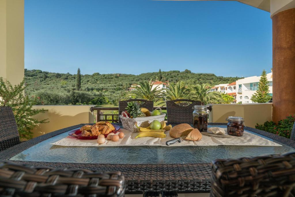 a table with a tray of food on a patio at Athena's Holiday Home - Ideal for large groups, by ZanteWize in Tsilivi