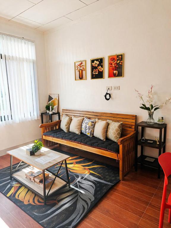 a living room with a couch and a table at JRC Feel at Home in Puerto Princesa City