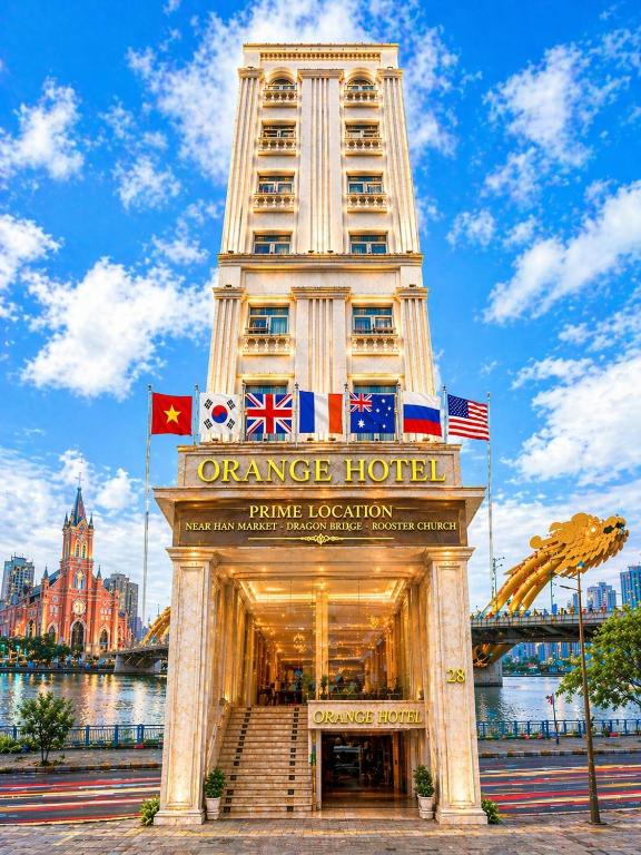 a hotel with the entrance to the orange hotel at Orange City Center Hotel Da Nang - Near Han Market & Dragon Brigde in Danang