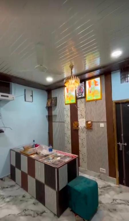 a room with a counter and a room with a door at Shree ram lodge in Maihar