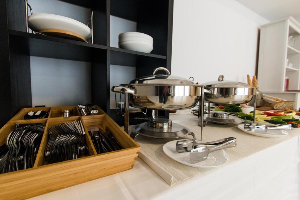 Kuchyň nebo kuchyňský kout v ubytování Hotel Evianne Boutique