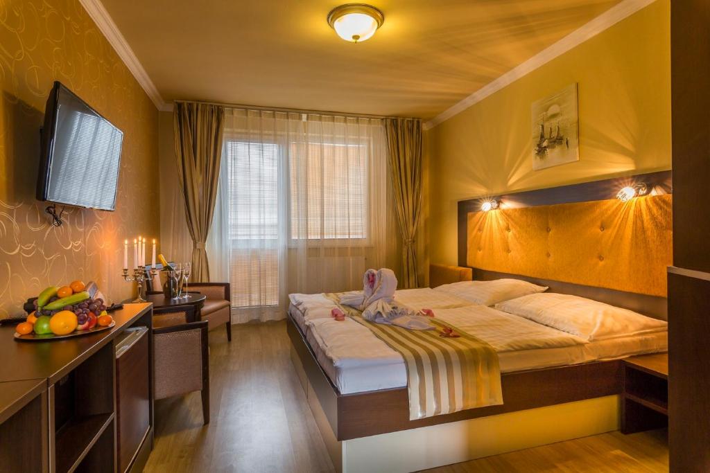 Postel nebo postele na pokoji v ubytování Hotel Sun