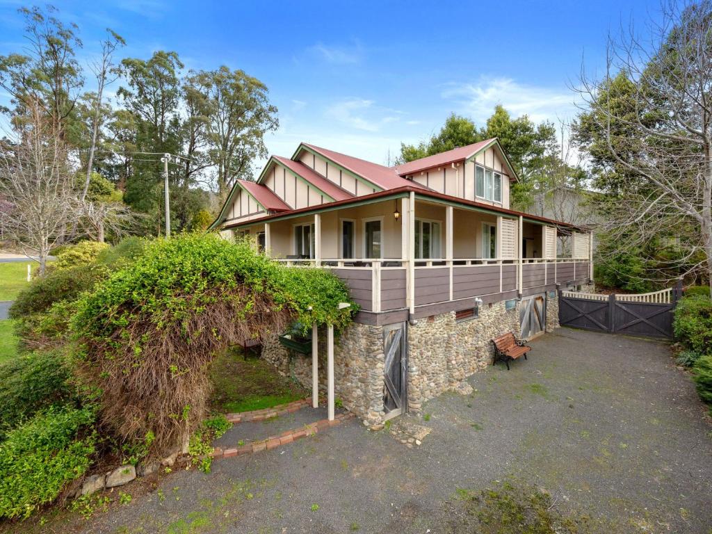 a house with a porch on top of a stone wall at The Gables in Marysville