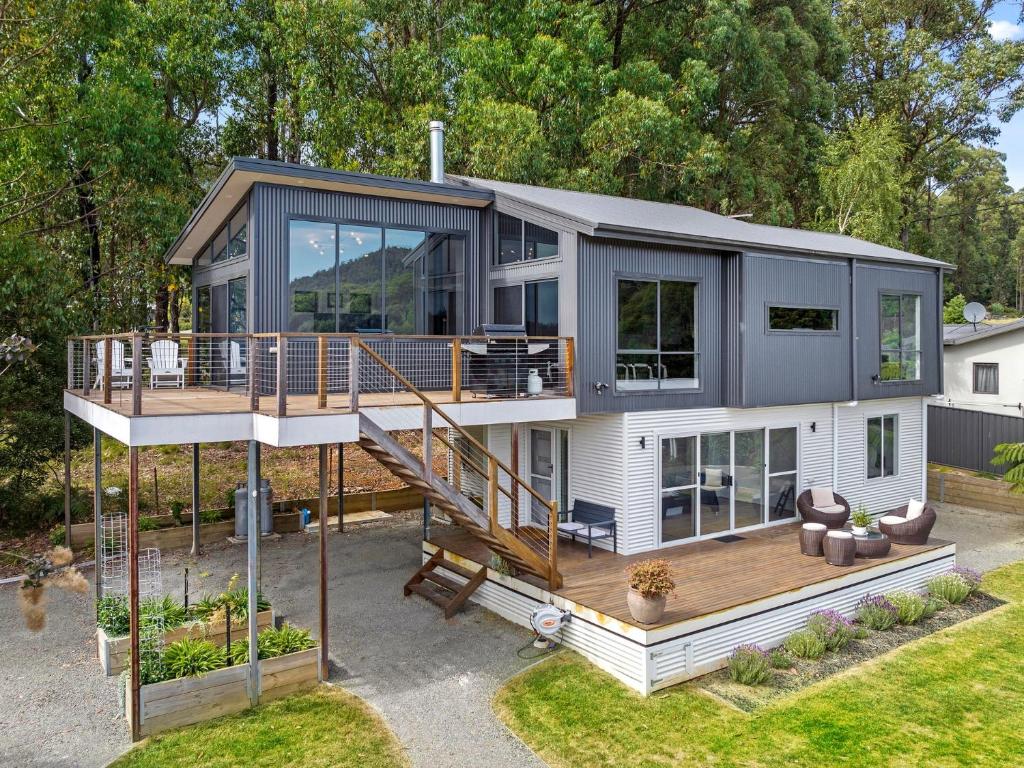 a modular home with a deck and a house at The Nest on Hull in Marysville