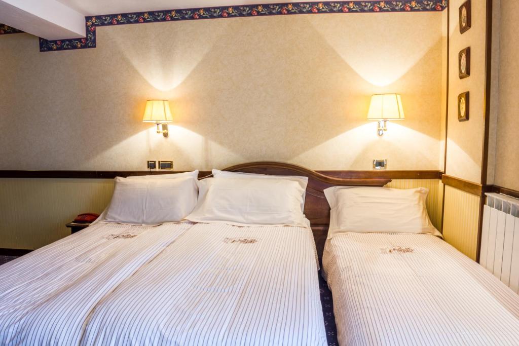 Postel nebo postele na pokoji v ubytování Hotel Petit Prince