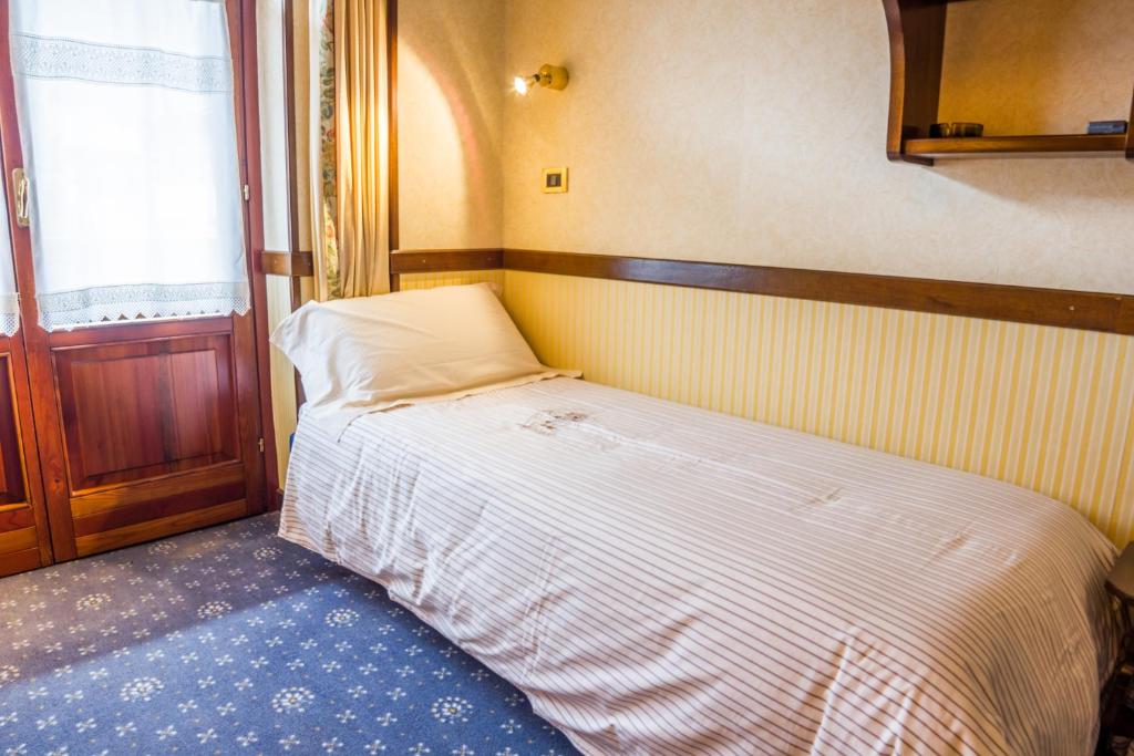 Postel nebo postele na pokoji v ubytování Hotel Petit Prince