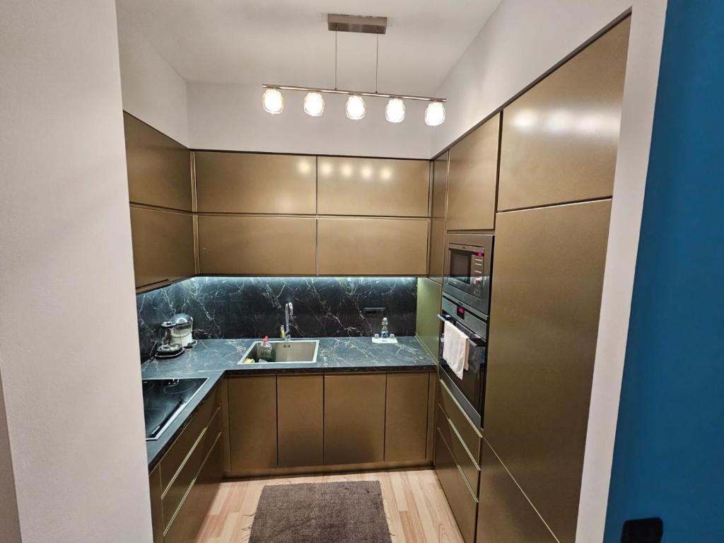 a kitchen with a sink and a counter at central apart in Tirana