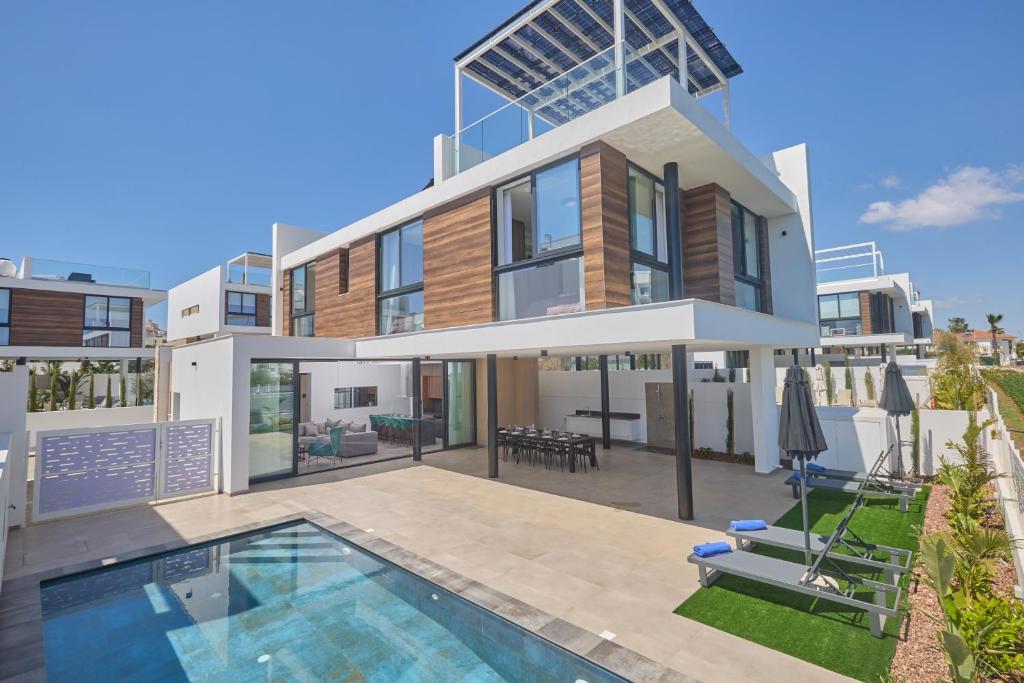 an image of a house with a swimming pool at Aqua Pearl Villas in Protaras