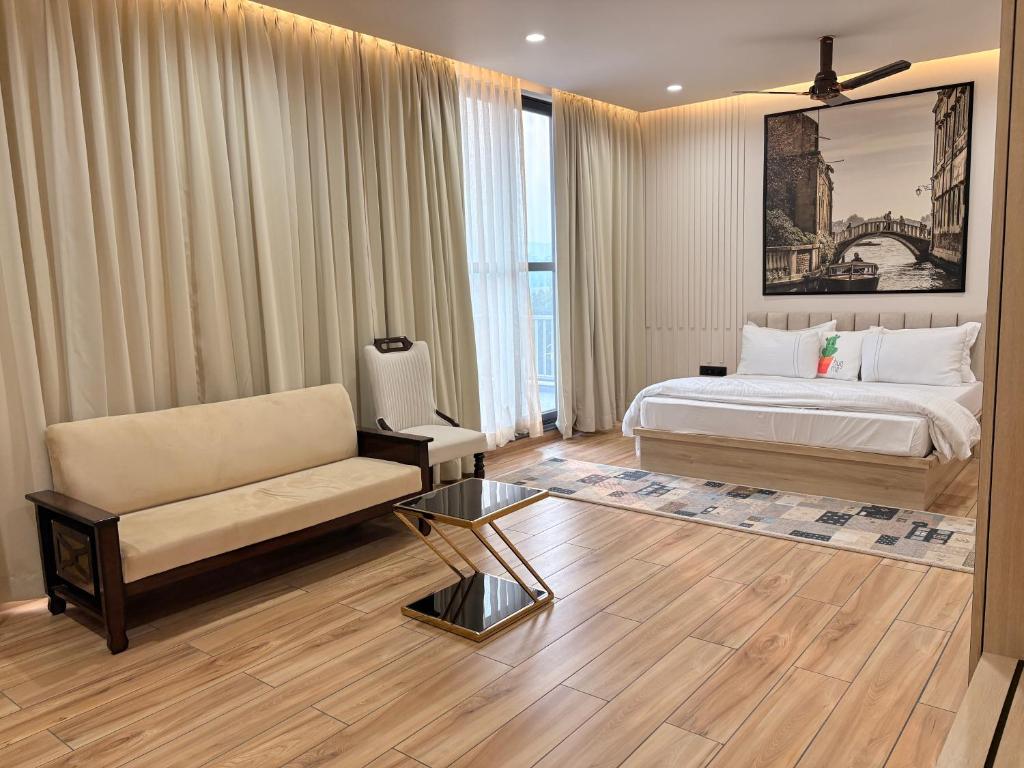 a hotel room with a bed and a couch at Ek Tara Guest House in Udaipur