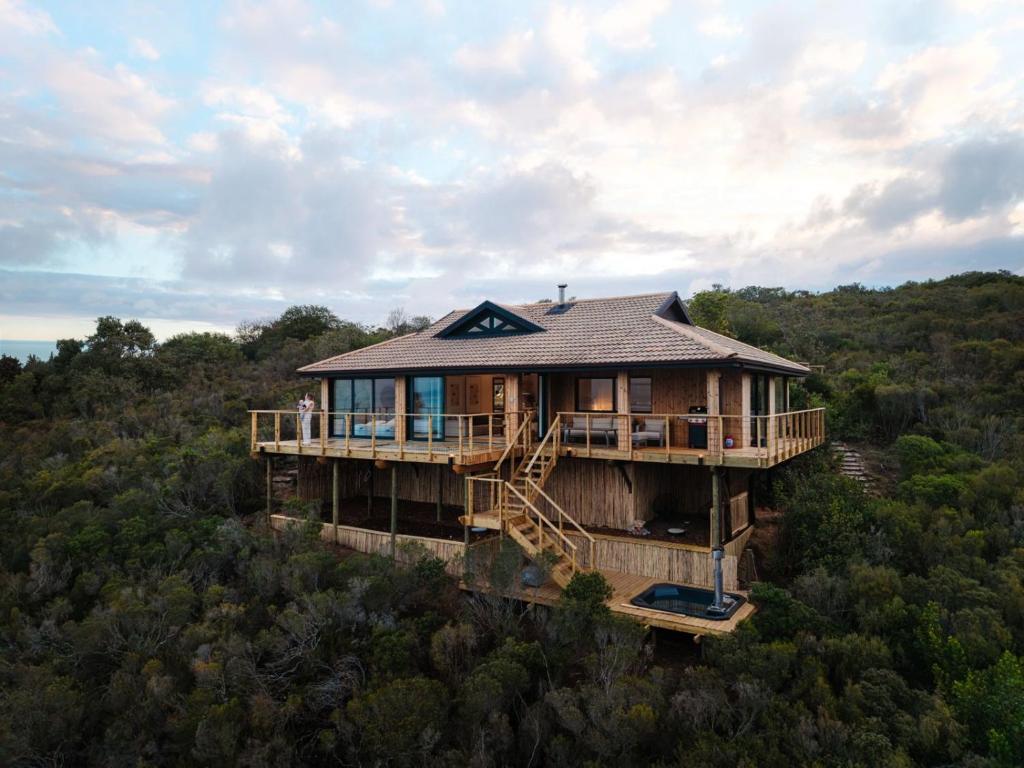 an overhead view of a house in the woods at Ocean's Edge - Private Nature Reserve in George