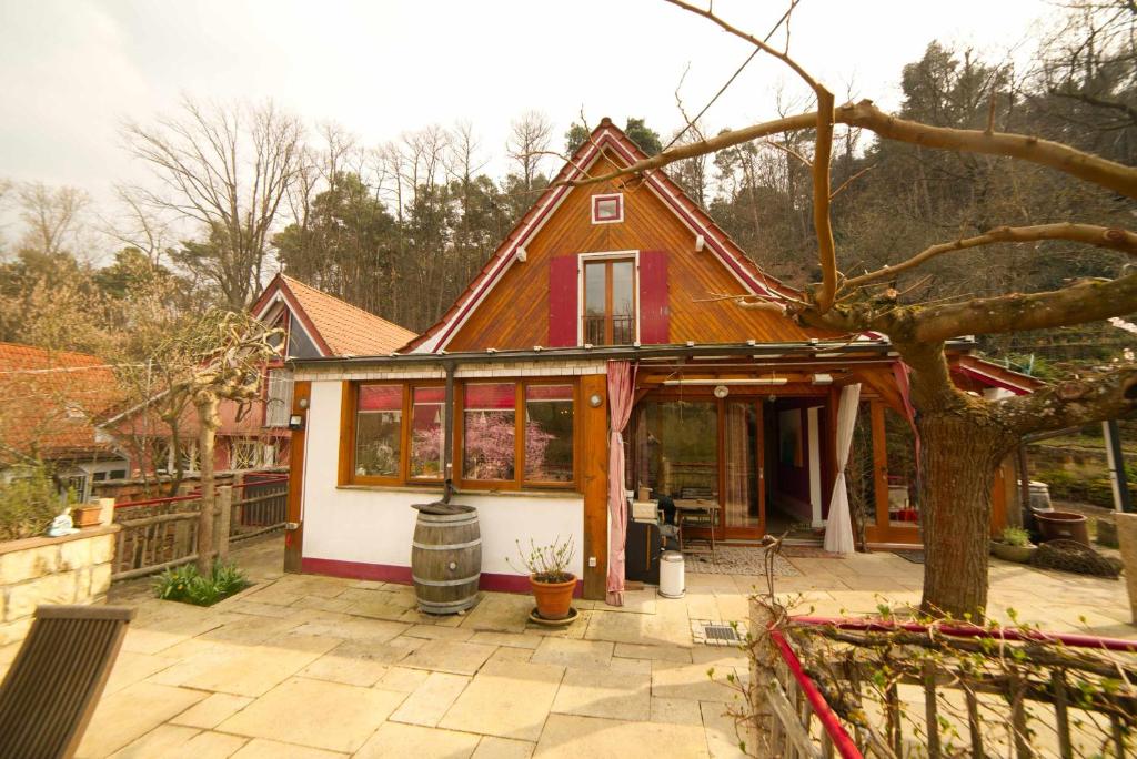 a small house with a red roof at Haus im Rübental in Bad Dürkheim