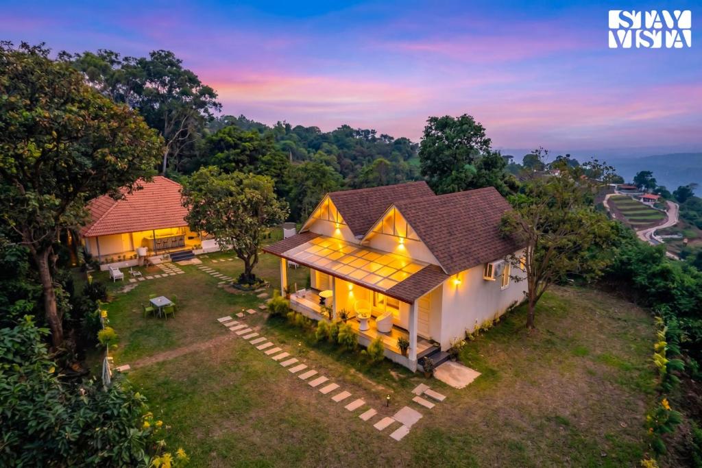 an aerial view of a villa with a house at StayVista at Jungle Jade with WiFi in Madikeri