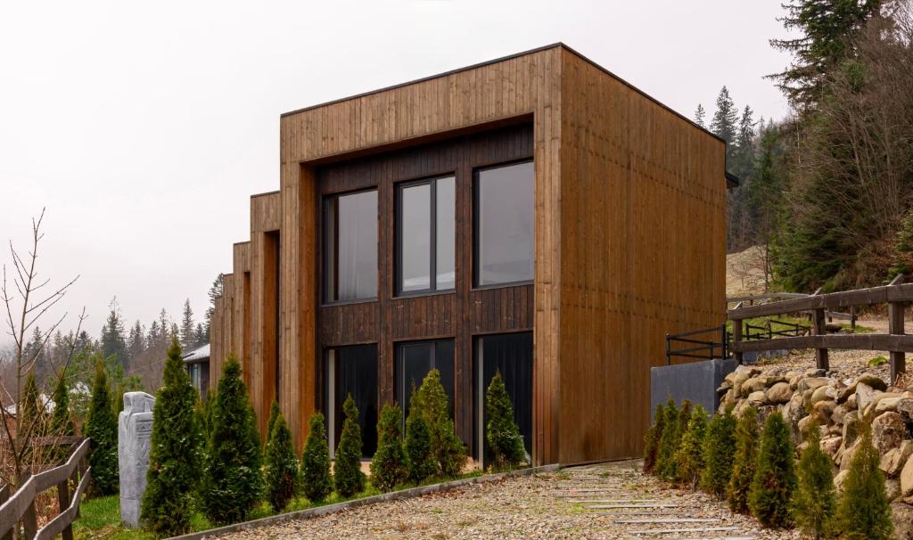 a house on the side of a mountain at Agate Resort & SPA in Mykulychyn