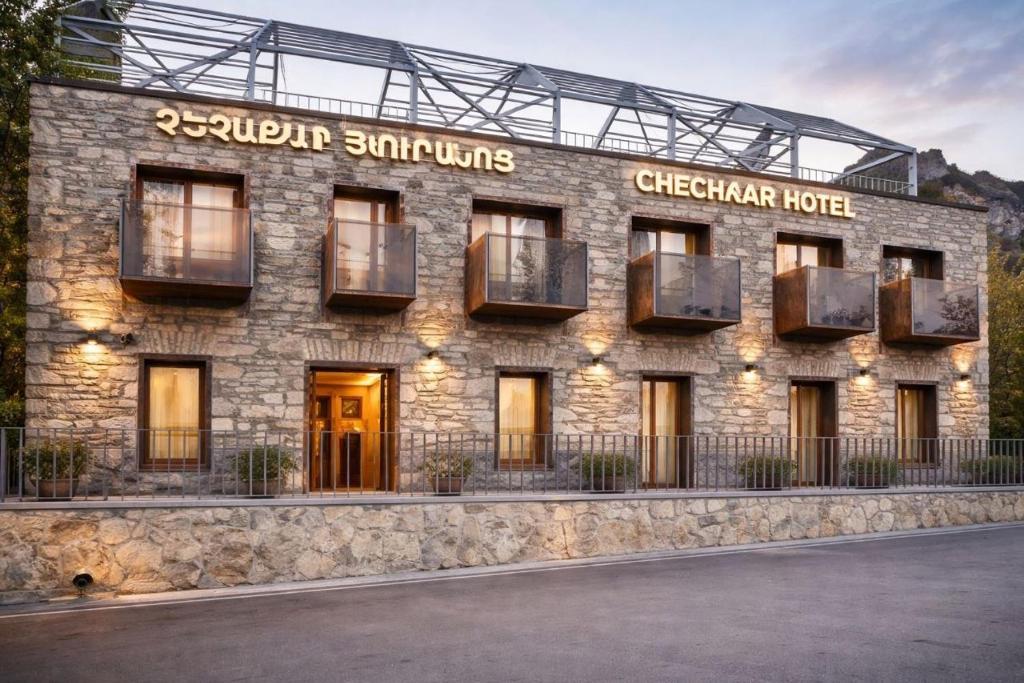 a stone building with a sign on it at Chechakar Boutique Hotel in Ditavan