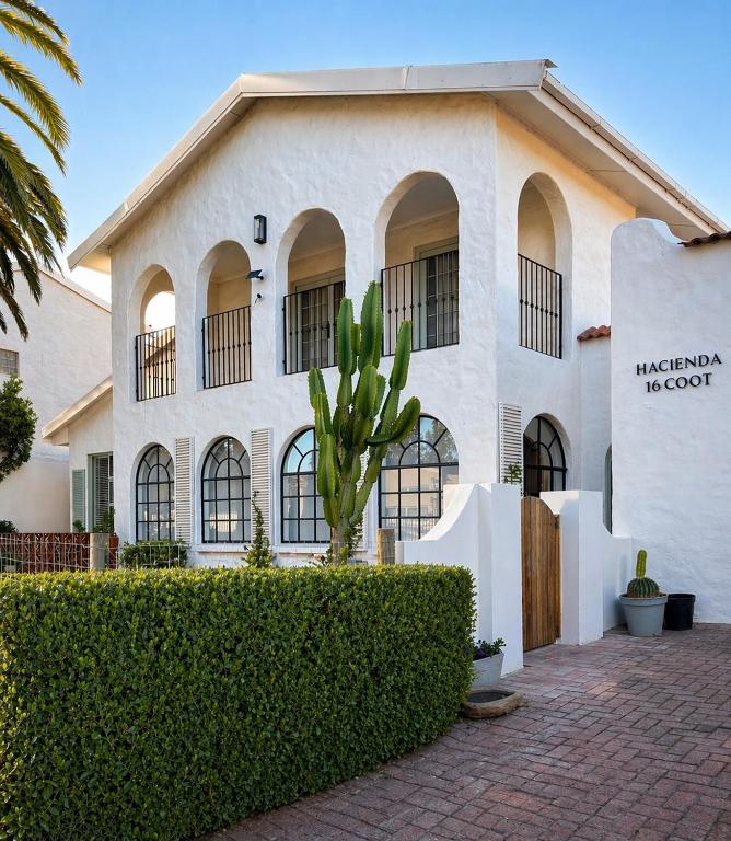 a building with a plant in front of it at Hacienda in Cape Town