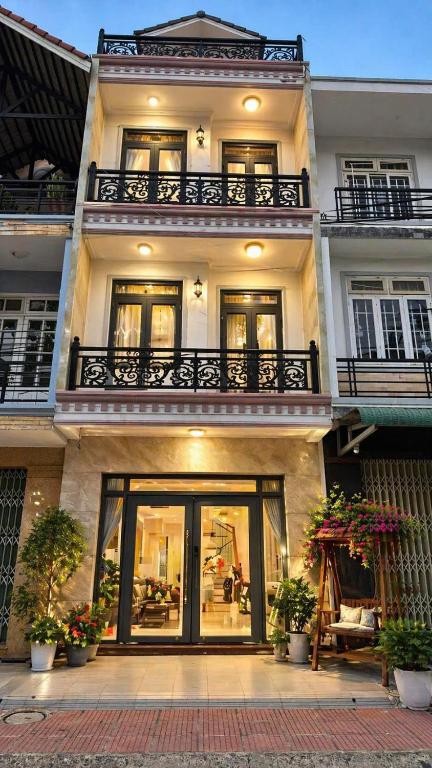 a large house with a balcony on top of it at Nguyên căn villa Đà Lạt in Da Lat