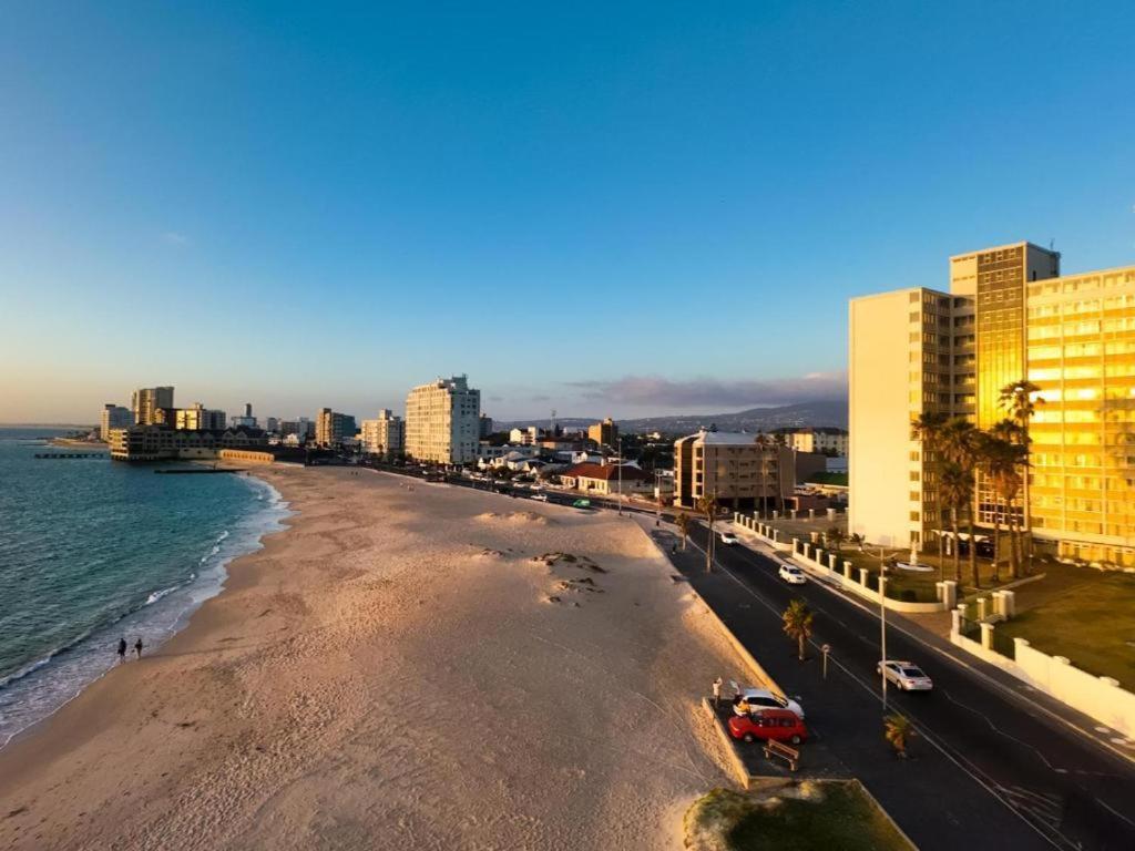 a view of a beach with buildings and the ocean at Sea Esta On Beach in Strand